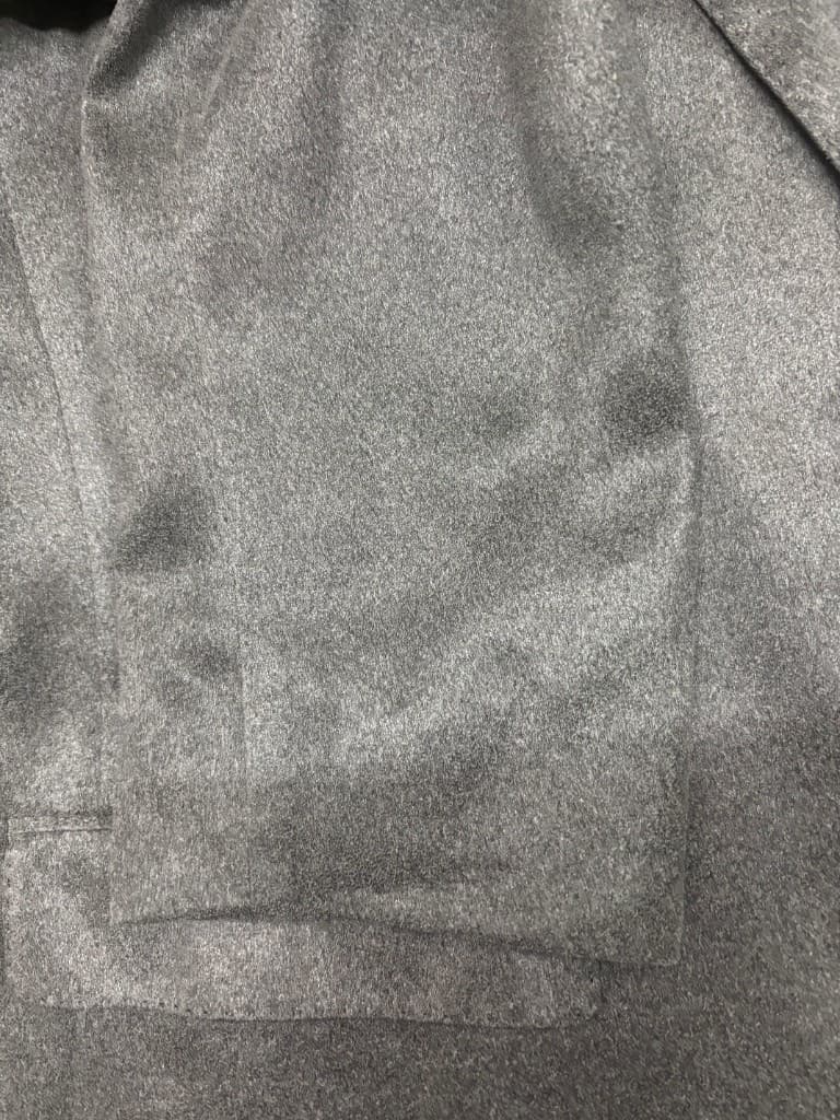 コートの袖口のシミ抜き（洗浄後）